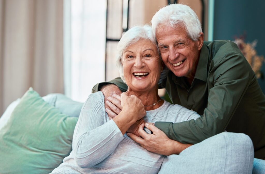 A happy senior couple holding each other closely.