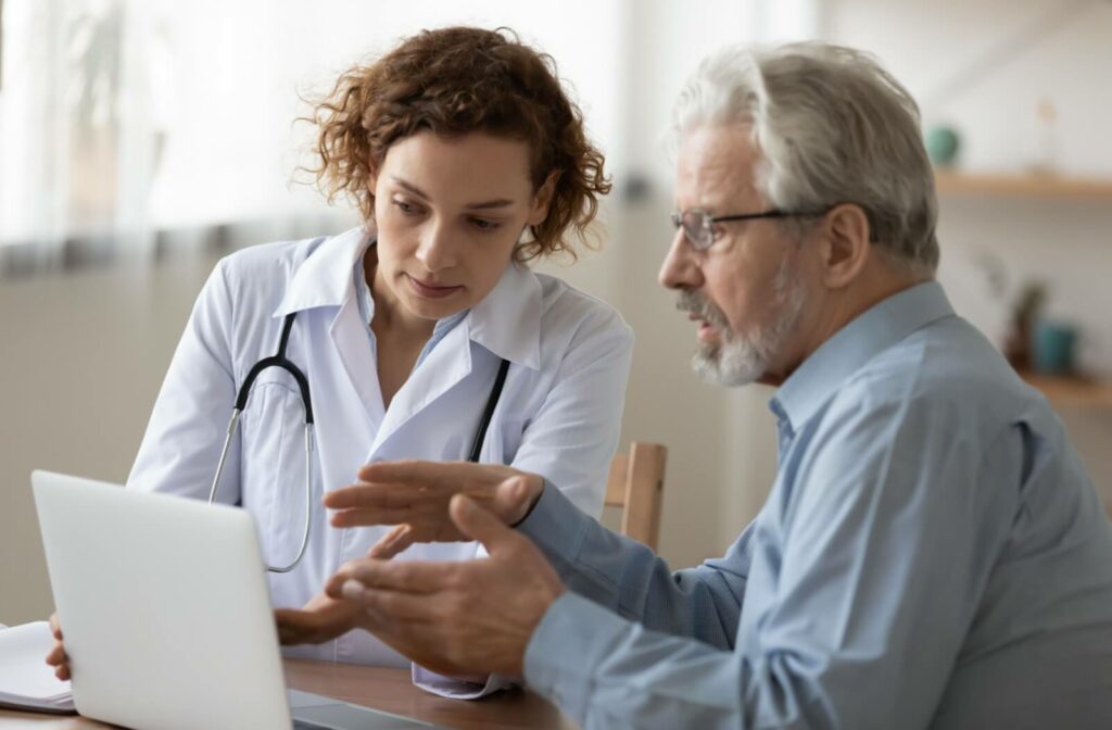 A senior talks to their doctor about their health needs to help determine what kind of senior living support they need
